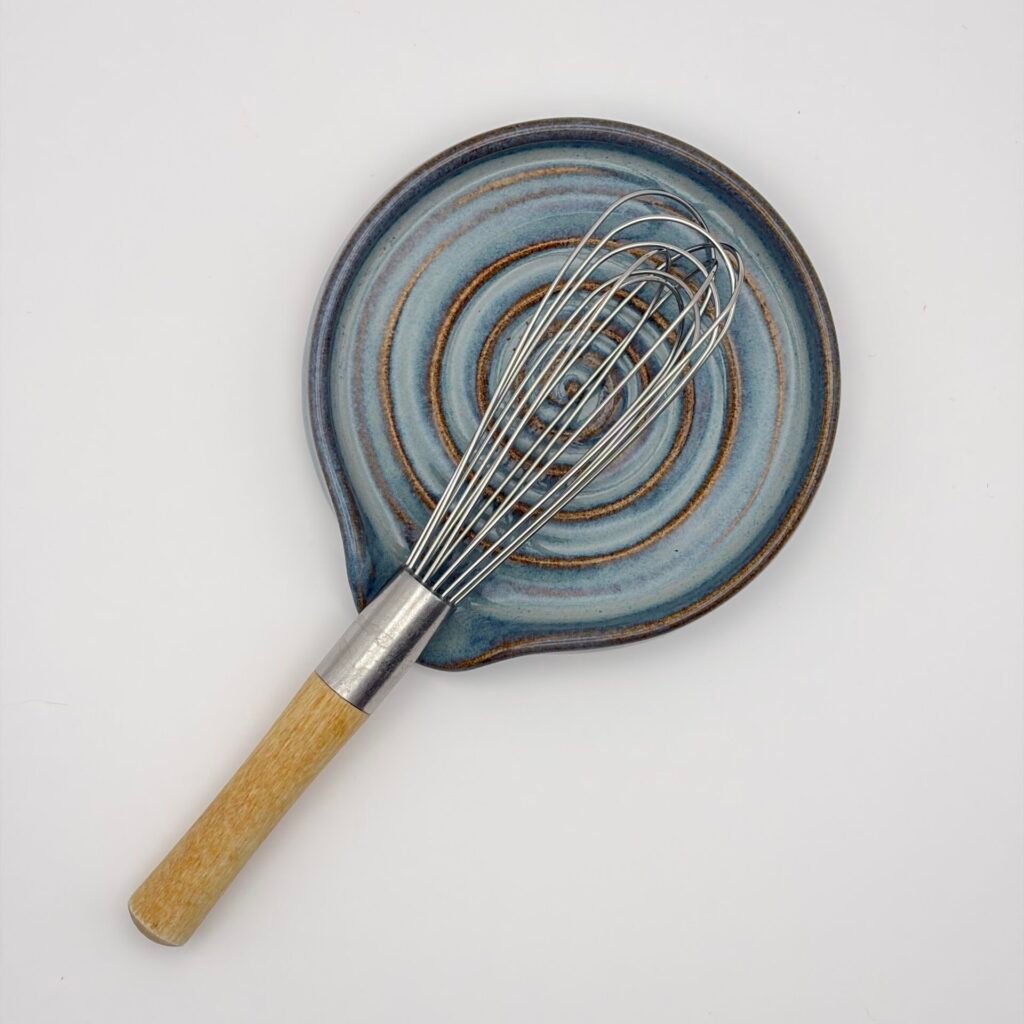 Handmade ceramic spoon rest with spiral design in blue rutile glaze, Isle of Man pottery by JFC Ceramics