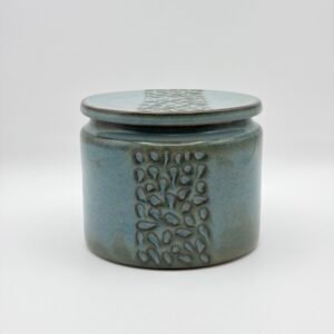 Handmade ceramic lidded jar with textured stripe design in blue rutile glaze, made by JFC Ceramics