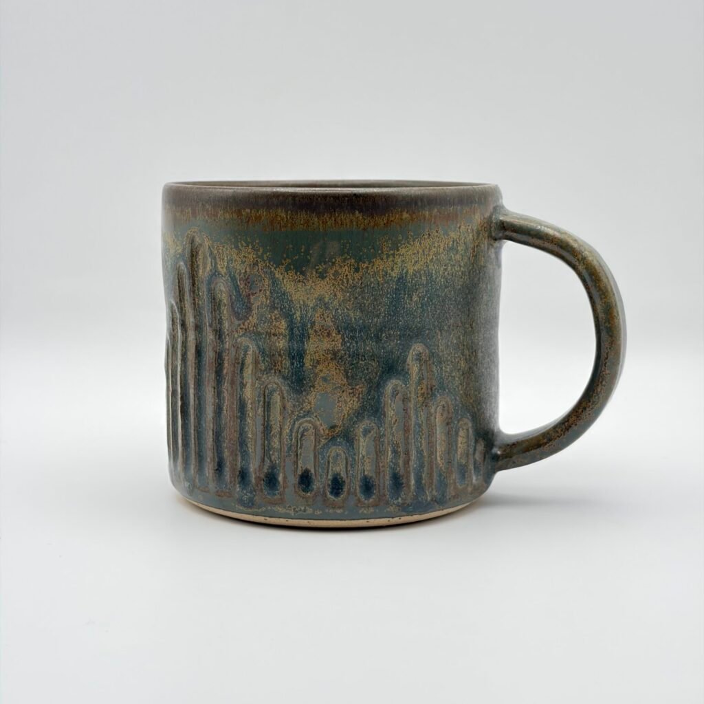 Large handmade ceramic coffee mug with lined design in smoke green glaze, made in the Isle of Man
